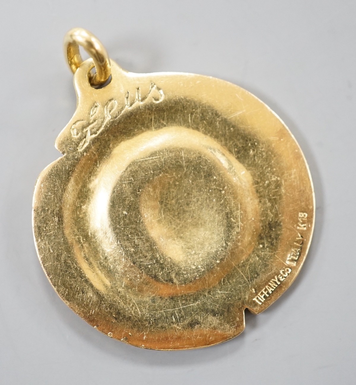 A modern Italian 18k yellow metal Tiffany & Co circular pendant, decorated with the bust of Zeus, 28mm, 11.1 grams, with Tiffany & Co box.